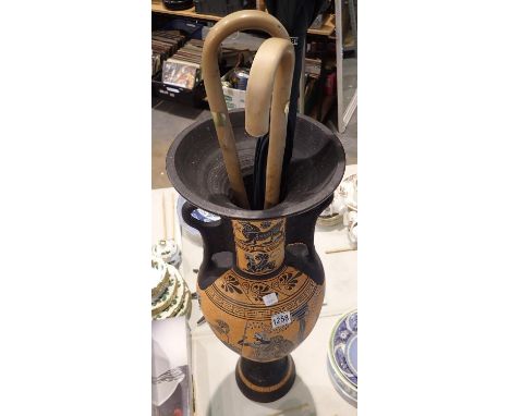 Large modern ceramic Greek style urn with two walking sticks, H: 90 cm. Not available for in-house P&amp;P, contact Paul O'He