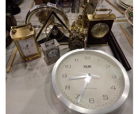 Collection of eight clocks including Imperial heavy brass Quartz carriage clock and anniversary clock. Not available for in-h