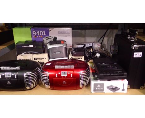 Shelf of electrical items including Crosley record player with power supply, Bluetooth speakers, cassette players, cassette r