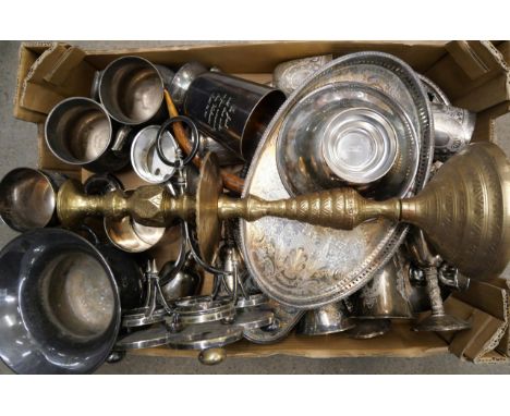 A box of silver plate; two sets of goblets, trays, mugs, etc., and a tall Indian brass candlestick **PLEASE NOTE THIS LOT IS 