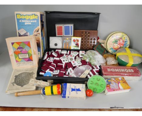 A box of vintage games, Mah-jong, Boggle, playing cards, solitaire, etc. **PLEASE NOTE THIS LOT IS NOT ELIGIBLE FOR IN-HOUSE 