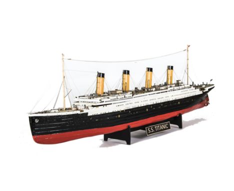 A 1:250 scale  scratchbuilt wooden model of SS 'Titanic', built and painted to a good standard, presented on a wooden stand, 