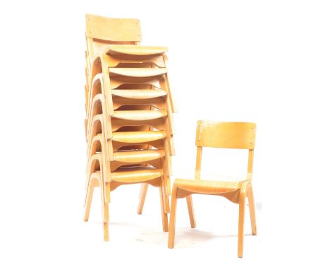 A set of eight vintage 20th century reclaimed ply bentwood stacking school chairs. The chairs being raised on A frame legs wi