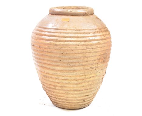 A Large and decorative terracotta garden barrel planter pot of baluster cylindrical form.Measures approx. 54cm