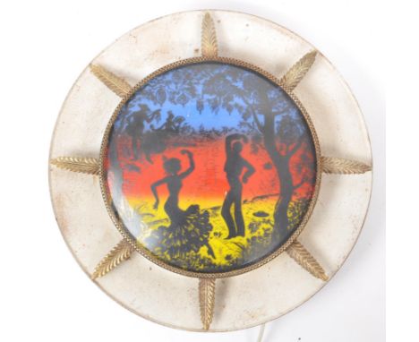 A vintage mid  century flamenco dancer wall light. The light with a circular metal coned base and a flat blue, red and yellow