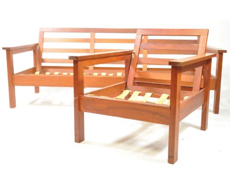 British Modern Design - A mid 20th century teak day bed / sofa and armchair. Each having ladder backs over block wooden frame