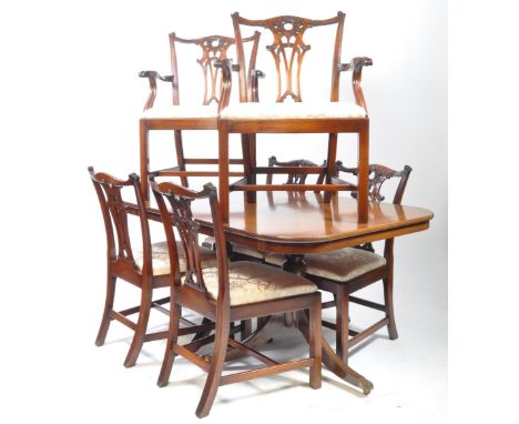 Six 20th century reproduction mahogany Chippendale Revival chairs with twin pedestal D end dining table. Each having ornate p