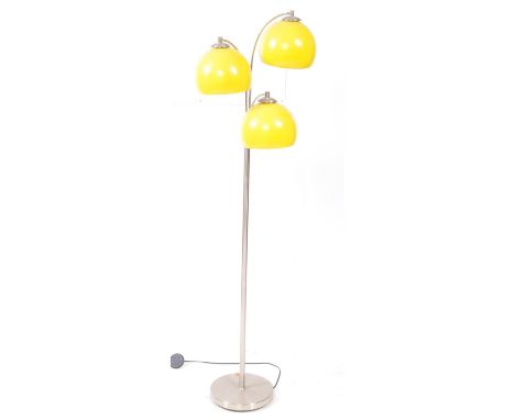 A contemporary space age style standard / floor standing lamp. The lamp having a series of there yellow domed shades over chr