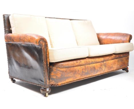 A 20th century circa 1930s leather upholstered two seater sofa. The sofa being upholstered in leather with steel studs to edg