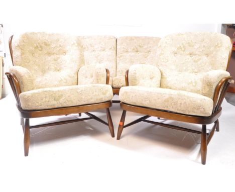 Ercol Furniture - Windsor Range - A 20th century Ercol living room suite. The suite comprising of two Windsor armchairs along