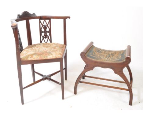 An early 20th century Edwardian corner armchair togethet with a mahogany Arts &amp; Crafts piano stool. The armchair raised o