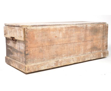 A large 20th century two plank top trunk / chest. Rectangular form with metal carry swing handles to side, spacious interior 