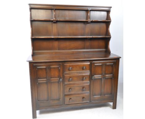 Ercol - Old Colonial - A mid 20th Century dark elm wood Ercol old colonial side / high board dresser. Having a removable plat