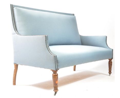 An Edwardian circa 1900s two seater sofa/settee. The window seat being wholely upholstered in a pale blue fabric with metal s