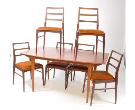 McIntosh of Kirkcaldy - A retro mid-20th-century teak wood extending dining table and six chairs. The dining table having a r