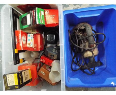 A selection of glass and plastic measuring cups, a selection of vintage cameras to include Kodak, Zenit, Boots Pacer Companio