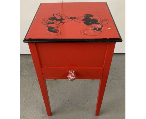 A red painted sewing box with Mickey &amp; Minnie Mouse detail to top. Small front drawer with red and white polka dot cerami