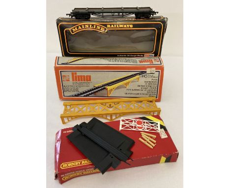 3 boxed vintage 00 gauge model railway accessories. A Mainline Railways Bogie Bolster C wagon (no inner packaging to box), a 