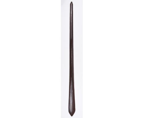 * Tribal Art. A Soloman Islands hardwood club, of plain tapered form with medial ridge, 123.5 cm long QTY: (1)