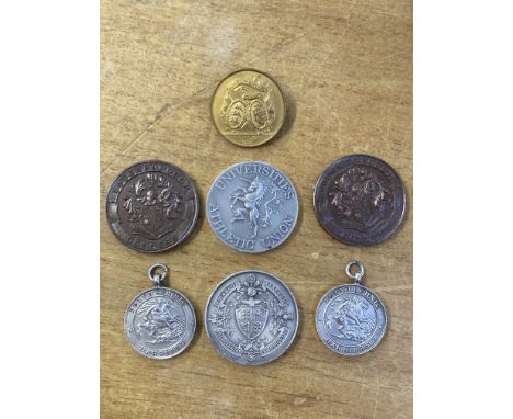* Sports Medals. A collection of athletics medals, including a silver medal for Amateur Athlete Association Championships, re