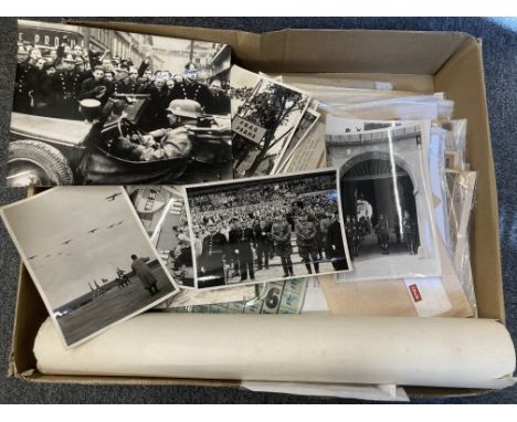 * Third Reich. A collection of WWII German ephemera, including 10 black and white press photographs taken after the German in