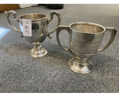 * Silver Trophies. A George V silver two handled trophy cup by Adie Brothers Ltd, Birmingham, circa 1927, of goblet form with