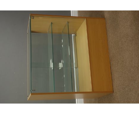 Light wood and glazed shops display cabinet enclosed by sliding glass doors, with two glass shelves and drawer, W91cm, H91cm,