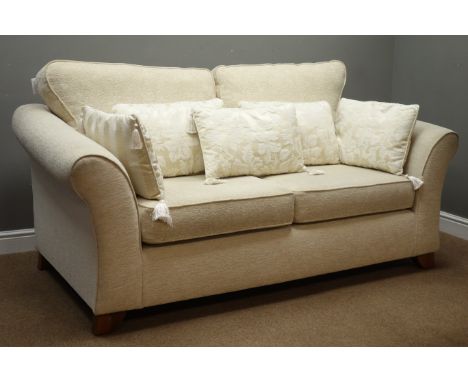 Three piece lounge suite; three seat sofa upholstered in cream fabric (W190cm, D101cm), and matching pair armchairs (W94cm)  