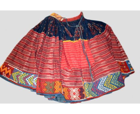 Banjara woman's skirt, probably Maharashtra, north west India, 20th century, the indigo top block printed, embroidered waistb