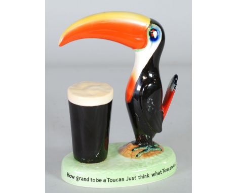 CARLTON WARE FOR GUINNESS, TOUCAN AND PINT ADVERTISING POTTERY GROUP, with inscription to the edge of the oval base, black pr