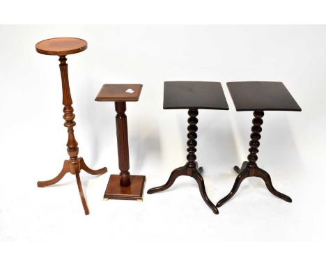 A pair of mahogany occasional tables, each with rectangular top, bobbin turned column and three outswept supports, together w