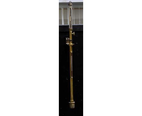 HENRY BROWNE & SON LTD; a brass cased gimbal mounted marine barometer/thermometer with silvered dials and brass gimbal mount,