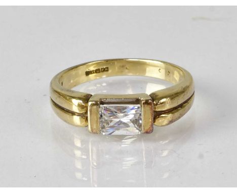 A 9ct yellow gold ring set with rectangular white stone, marked 375, size M, approx. 3.2g.Condition Report: Stone is loose
