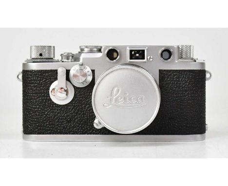 LEICA; a model IIIf camera, serial no. 728092 dating to 1954, accompanied by a 50mm Summicron f/2 lens, serial no. 1169472, 1