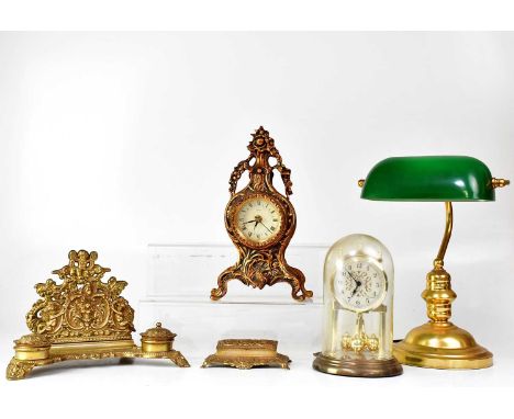 A Rococo-style brass desk tidy with letter rack, pen tray and a pair of ink wells, together with one other similar item, a re