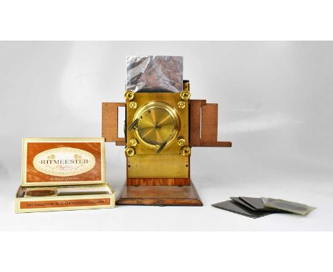 A mahogany cased magic lantern with brass mounts and lens, together with a quantity of slides.  Condition Report: This lot ha
