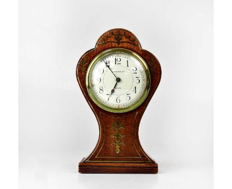 A balloon-shaped mantel clock with brass inlay, the dial set with Arabic numerals, height 22.7cm, together with a small quant