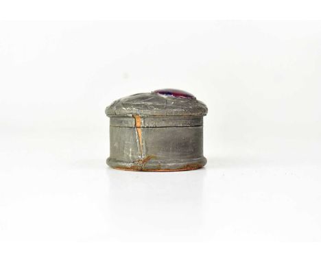 An Arts and Crafts pewter ring pot with Ruskin-style porcelain roundel inset to the lid, painted with purple and maroon pansy