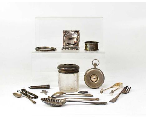A group of hallmarked silver items, comprising two teaspoons, a set of sugar tongs, a napkin ring, a child's bangle and a dre