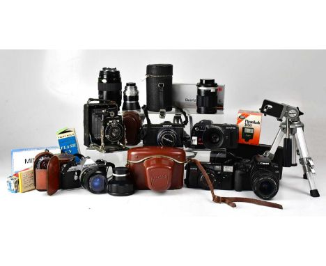 A collection of vintage cameras and accessories to include a Pentax ME Super, a Canon EOS 400D with zoom lens, an Edixa Refle