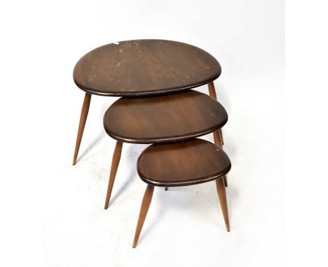 ERCOL; a 'Pebble' nest of three tables, on turned tapering legs, height or largest 40cm.Condition Report: Tops are scuffed an