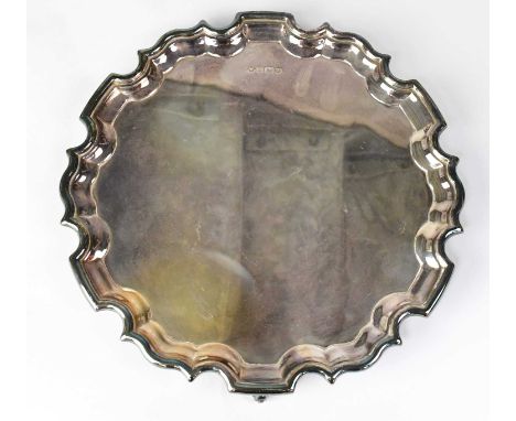 CARR'S OF SHEFFIELD; an Elizabeth II hallmarked silver salver raised on three scroll feet, Sheffield 1993, diameter 25.5cm, a