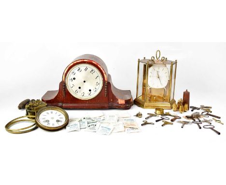 A quantity of various clock and watch parts to include a Comer anniversary clock, a Napoleon hat mantel clock with silvered d