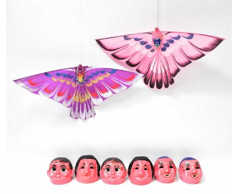 A set of six Chinese brightly painted papier-mâché theatrical masks, heights approx. 23.5cm, together with two kites in the f