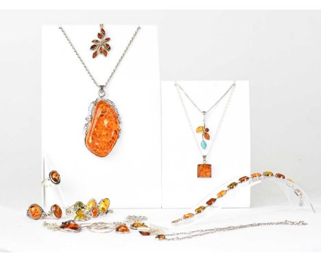 A collection of silver and white metal mounted Baltic amber, to include rings and pendants.Condition Report: All pieces appea