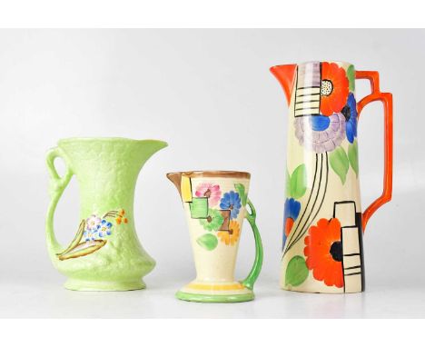 Three Art Deco pottery jugs comprising a James Kent Ltd green jug with embossed flower head decoration, numbered 1156, height
