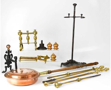A quantity of gilt brass and other cast metal fireside accoutrements, including a pair of ornate grate sides decorated with u