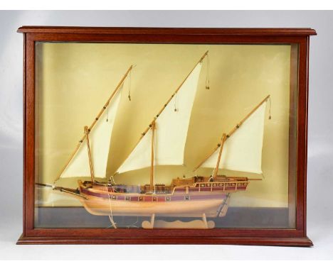 A scratch-built model of a three-masted sailing boat, in a glazed wooden case, 50 x 67cm.Condition Report: Good condition