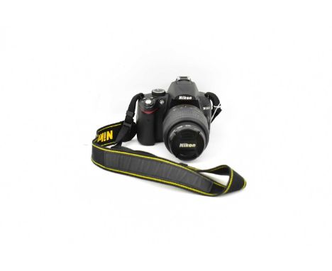NIKON; a D5000 camera body, an AF-5 DX Nikkor 18-55mm 1:3.5-5.5g VR lens, with instruction booklet, cables and box.Condition 