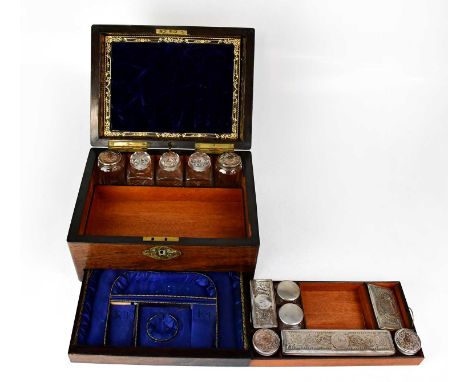 A Victorian rosewood travelling vanity case, the lid with mother-of-pearl insert, the partial two-tier fitted interior with a